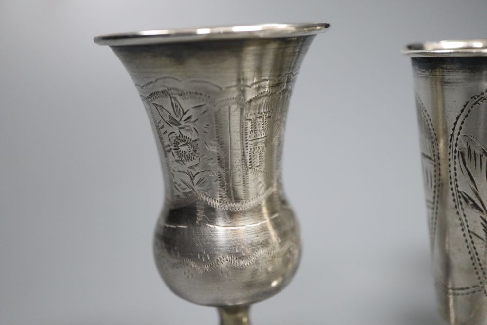 Eleven assorted mainly early 20th century silver kiddush cups and two similar Russian cups, gross 11.25oz.